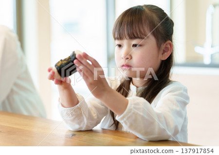 A girl who eats onigiri A girl who eats onigiri 137917854