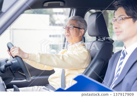Elderly drivers taking the driver's license renewal test. 137917909