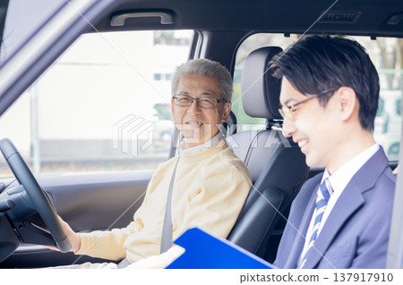 Elderly drivers taking the driver's license renewal test. 137917910