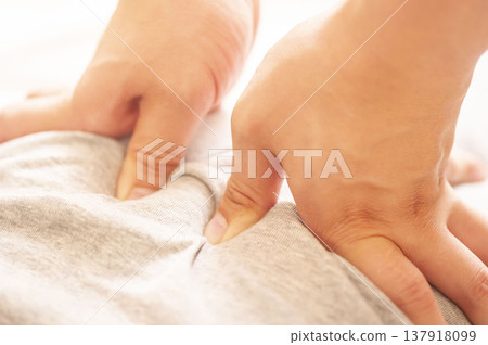 A scene of manual therapy: A chiropractor performing acupressure massage on the back. Relaxation and wellness image. 137918099