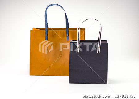 Orange and black paper bags, white bags, shopping bags, tote bags, gift bags, commercial and advertising materials. Orange and black paper bags, white bags, shopping bags, tote bags, gift bags, commercial and advertising materials. 137918453