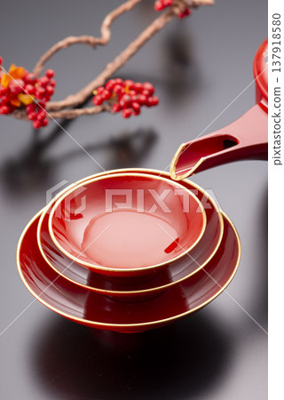 Vermilion lacquered sake set (Toso set): Lacquered sake cups and bowls for New Year's celebrations, traditional Japanese lacquerware. Vermilion lacquered sake set (Toso set): Lacquered sake cups and bowls for New Year's celebrations, traditional Japanese lacquerware. 137918580