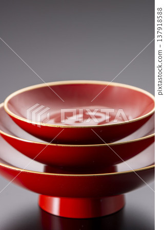 Vermilion lacquered sake set (Toso set): Lacquered sake cups and bowls for New Year's celebrations, traditional Japanese lacquerware. Vermilion lacquered sake set (Toso set): Lacquered sake cups and bowls for New Year's celebrations, traditional Japanese lacquerware. 137918588
