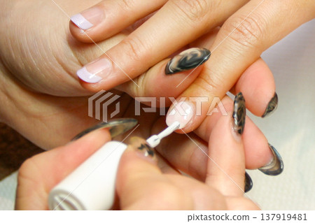 Female hands doing nails Female hands doing nails 137919481