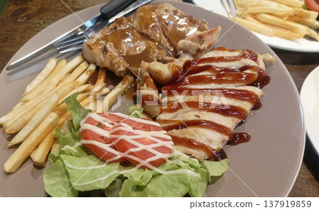 Pork steak with vegetable salad Pork steak with vegetable salad 137919859