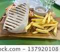 Shawarma with tartar sauce and French fries 137920108