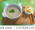 Cream of mushroom soup with croutons on a board 137920110