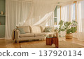 A bright, natural living room with a white sofa, monstera plant, glass table, and stylish Scandinavian-style interior. 137920134