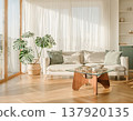 A bright, natural living room with a white sofa, monstera plant, glass table, and stylish Scandinavian-style interior. 137920135