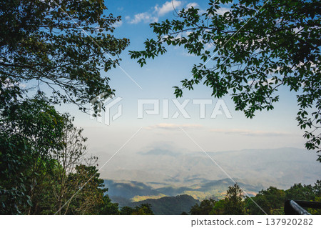 sunrise with moving of cloud and clear sky and layer of mountain sunrise with moving of cloud and clear sky and layer of mountain 137920282