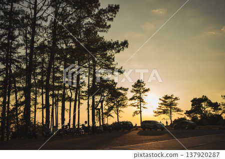 sunset with moving of cloud and clear sky and layer of mountain sunset with moving of cloud and clear sky and layer of mountain 137920287