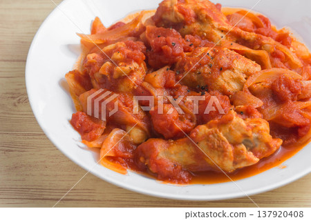 Chicken wings stewed in tomato sauce Chicken wings stewed in tomato sauce 137920408