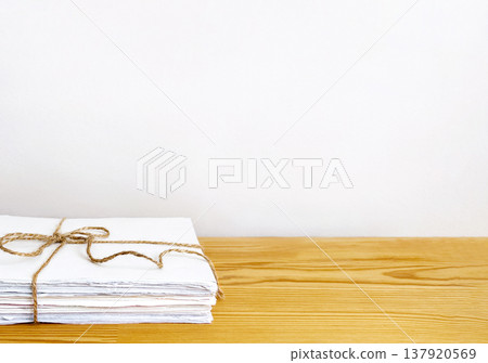 Eco-friendly paper waste recycling concept with copy space on wooden background Eco-friendly paper waste recycling concept with copy space on wooden background 137920569