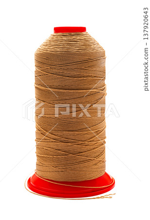spool of colored thread on a white isolated background spool of colored thread on a white isolated background 137920643