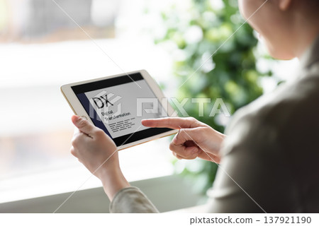 Women learning about digital transformation using tablets Women learning about digital transformation using tablets 137921190