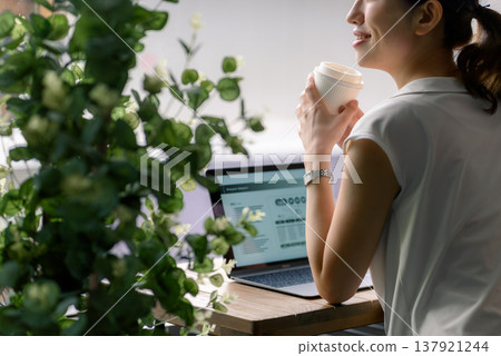 A woman on a break and her laptop 137921244