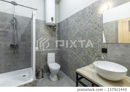 Modern Hostel Bathroom with Shower Cabin, Vessel Sink, and Toilet Modern Hostel Bathroom with Shower Cabin, Vessel Sink, and Toilet 137921445