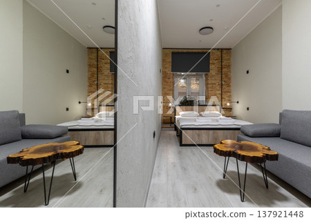 Modern Studio Apartment with Large Mirror, Sofa, and Live Edge Table Modern Studio Apartment with Large Mirror, Sofa, and Live Edge Table 137921448