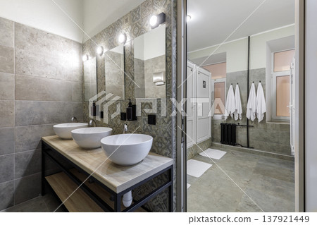 Spacious Modern Hostel Shared Bathroom with Multiple Vessel Sinks 137921449