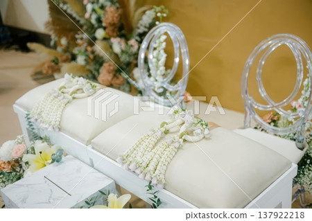 Traditional Thai Wedding Water Pouring Ceremony Setup with Flower Garlands Traditional Thai Wedding Water Pouring Ceremony Setup with Flower Garlands 137922218