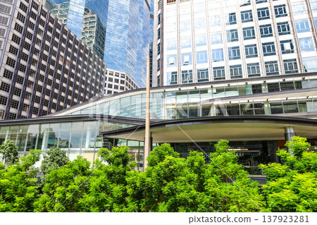 A cityscape with greenery and buildings 137923281