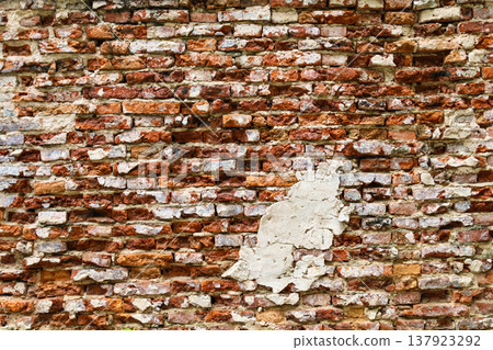 Uneven old red brick wall 137923292