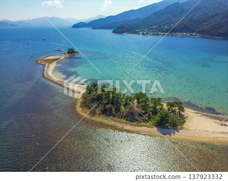 Drone aerial footage of Mizushima, an uninhabited island in Tsuruga City, Fukui Prefecture, often referred to as the "Hawaii of Hokuriku." Ideal for tourism promotion and showcasing scenic spots. Drone aerial footage of Mizushima, an uninhabited island in Tsuruga City, Fukui Prefecture, often referred to as the "Hawaii of Hokuriku." Ideal for tourism promotion and showcasing scenic spots. 137923332