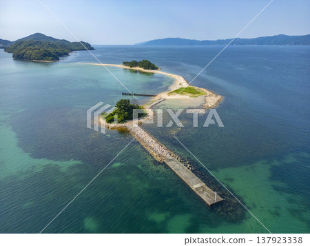 Drone aerial footage of Mizushima, an uninhabited island in Tsuruga City, Fukui Prefecture, often referred to as the "Hawaii of Hokuriku." Ideal for tourism promotion and showcasing scenic spots. Drone aerial footage of Mizushima, an uninhabited island in Tsuruga City, Fukui Prefecture, often referred to as the "Hawaii of Hokuriku." Ideal for tourism promotion and showcasing scenic spots. 137923338
