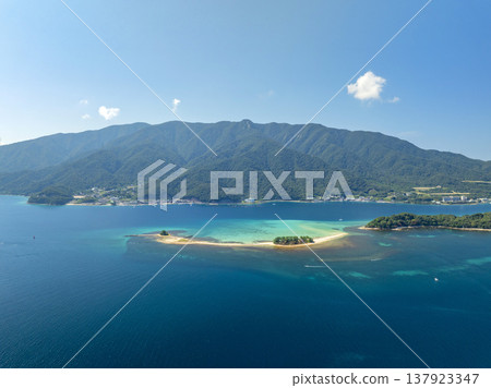 Drone aerial footage of Mizushima, an uninhabited island in Tsuruga City, Fukui Prefecture, often referred to as the "Hawaii of Hokuriku." Ideal for tourism promotion and showcasing scenic spots. Drone aerial footage of Mizushima, an uninhabited island in Tsuruga City, Fukui Prefecture, often referred to as the "Hawaii of Hokuriku." Ideal for tourism promotion and showcasing scenic spots. 137923347