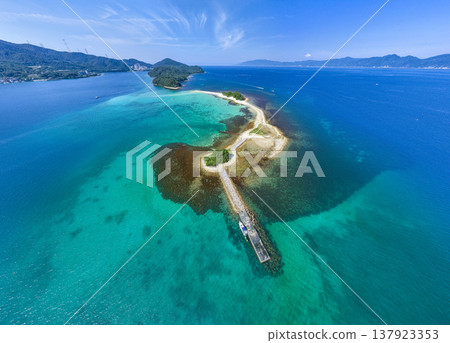 Drone aerial footage of Mizushima, an uninhabited island in Tsuruga City, Fukui Prefecture, often referred to as the "Hawaii of Hokuriku." Ideal for tourism promotion and showcasing scenic spots. 137923353