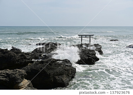 Kamiiso Torii Gate, Oarai Town, Ibaraki Prefecture: Rough waves crashing against the rocky shore and a sacred landscape. Kamiiso Torii Gate, Oarai Town, Ibaraki Prefecture: Rough waves crashing against the rocky shore and a sacred landscape. 137923676