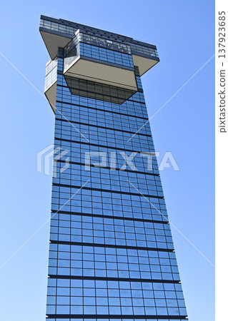 Oarai Marine Tower, Oarai Town, Ibaraki Prefecture: A modern observation tower with a geometric exterior that soars against the blue sky. Oarai Marine Tower, Oarai Town, Ibaraki Prefecture: A modern observation tower with a geometric exterior that soars against the blue sky. 137923685