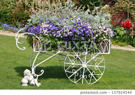 Garden with spring flowers Garden with spring flowers 137924544