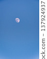 moon floating in the blue sky 137924937