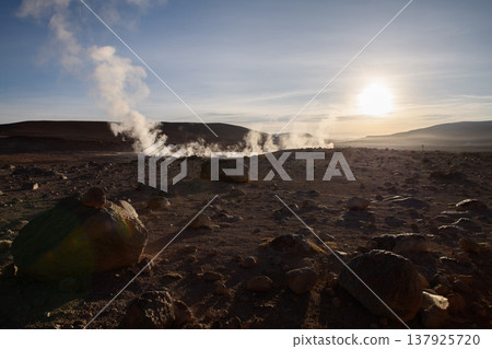 Dramatic sunrise over Sol de Manana geyser with geothermal steam 137925720