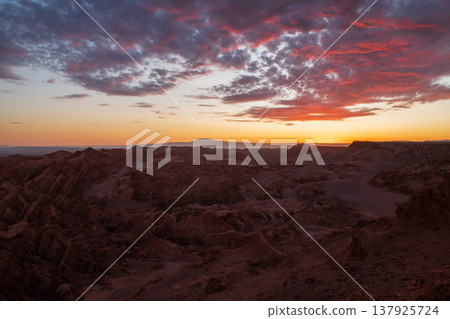 Dramatic sunset over rocky Valle de la Luna desert landscape Dramatic sunset over rocky Valle de la Luna desert landscape 137925724