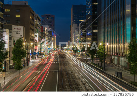 Light trails of cars running in the city at night 137926796