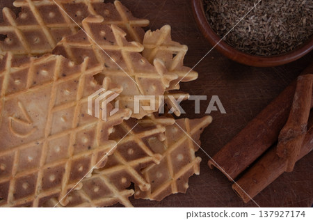 Top view of Italian aniseed biscuits with their flavoured ingredients. 137927174