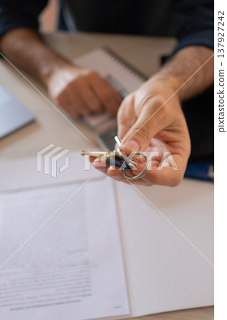 Real state agent handing over the keys to the property. Business concept. Real state agent handing over the keys to the property. Business concept. 137927242