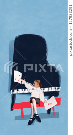 Little girl sitting at piano holding music notes sheet learning to play instrument. 137928291