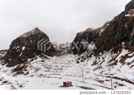 A view of snow-covered Momoiwa Rock from Momoiwa Observatory on Rebun Island in winter. 137928393