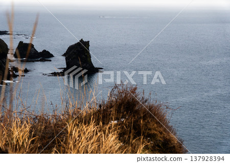 Cat Rock as seen from Momoiwa Observatory on Rebun Island in winter 137928394
