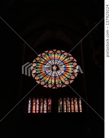 Phone photo of the rose window of Strasbourg Cathedral lit by sunlight. Architectural detail showing Gothic design, stained glass, and dramatic natural illumination. Phone photo of the rose window of Strasbourg Cathedral lit by sunlight. Architectural detail showing Gothic design, stained glass, and dramatic natural illumination. 137929224