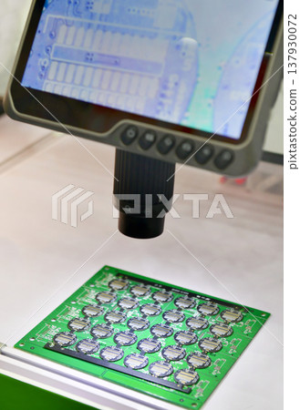 Digital microscope with LCD screen inspecting electronic circuit board in high resolution. Digital microscope with LCD screen inspecting electronic circuit board in high resolution. 137930072
