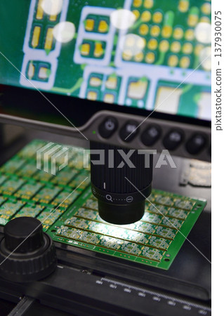 Digital microscope with LCD screen inspecting electronic circuit board in high resolution. Digital microscope with LCD screen inspecting electronic circuit board in high resolution. 137930075