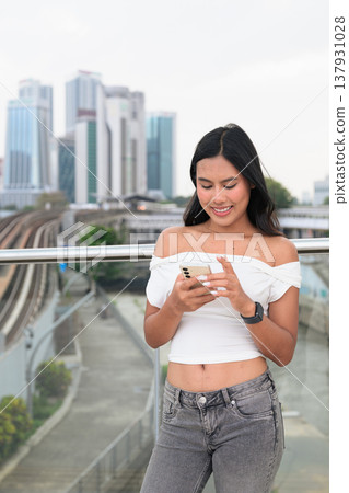 Asian Tourist Woman Using Phone in Kuala Lumpur River of Life Urban City Background Asian Tourist Woman Using Phone in Kuala Lumpur River of Life Urban City Background 137931028