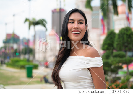 Smiling Thai Woman at Merdeka Square Kuala Lumpur in front of the Sultan Abdul Samad Building. 137931052