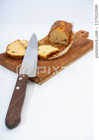 Slicing pound cake on wooden board for breakfast 137932996