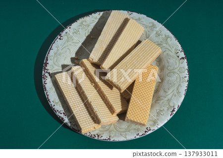 Wafers on plate with green background 137933011