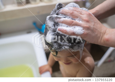 Baby getting a shampoo Baby getting a shampoo 137933220